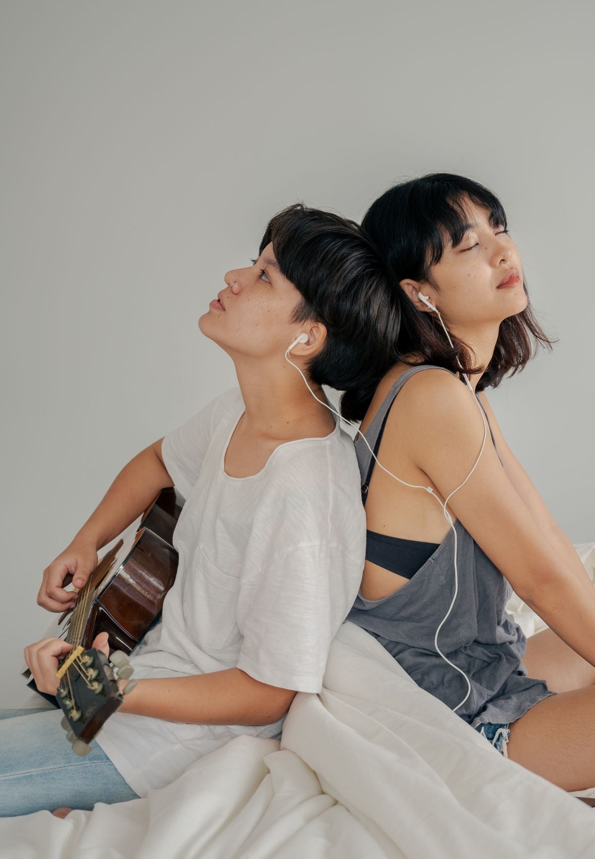 A couple relaxing together with music and a guitar